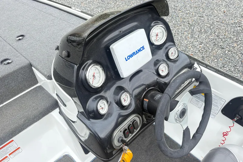 Slide: The Image of Steering console of a 2013 Nitro Z-7 boat with Lowrance display and gauges. - 12