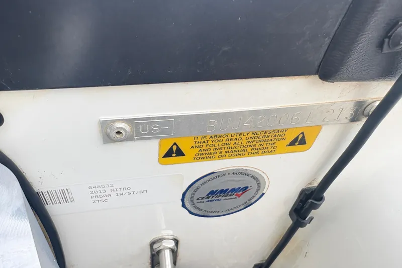 Slide: The Image of 2013 Nitro Z-7 boat identification plate with warning label and registration details. - 13