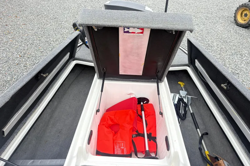 Slide: The Image of Open storage compartment in 2013 Nitro Z-7 boat with life jackets and equipment. - 6