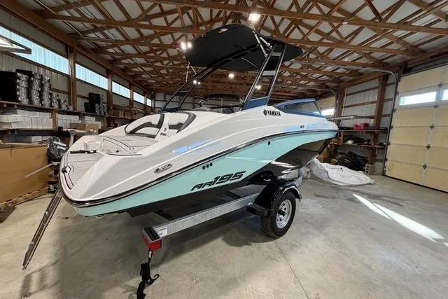 Slide: The Image of 2026 Yamaha Boats AR195 in a garage, showcasing sleek design and modern features. - 1