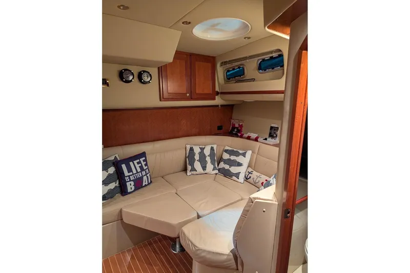 Slide: The Image of Luxurious 2007 Rampage 38 Express yacht interior with cozy seating and nautical decor. - 3