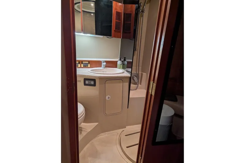 Slide: The Image of Bathroom interior of 2007 Rampage 38 Express yacht, featuring sink and shower. - 6