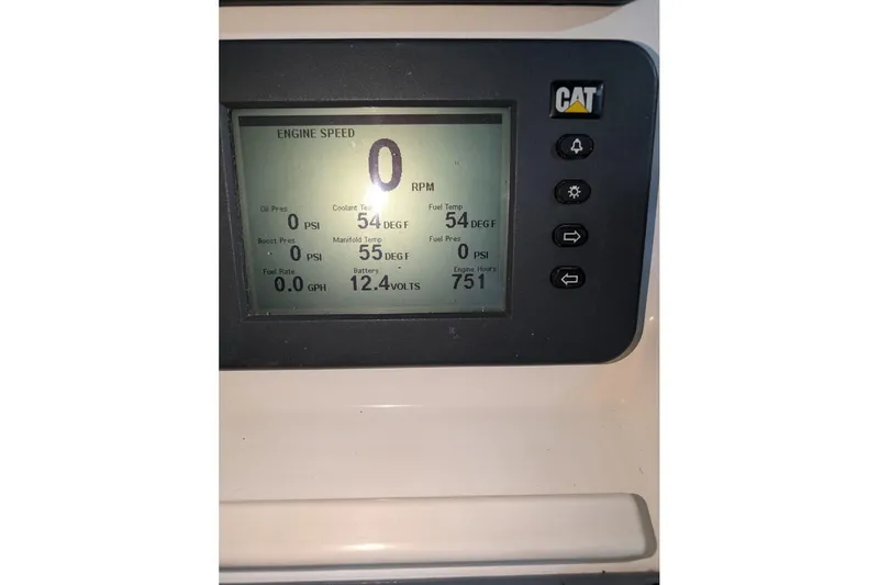 Slide: The Image of CAT engine display showing RPM, temperature, and battery voltage on a 2007 Rampage 38 Express. - 9