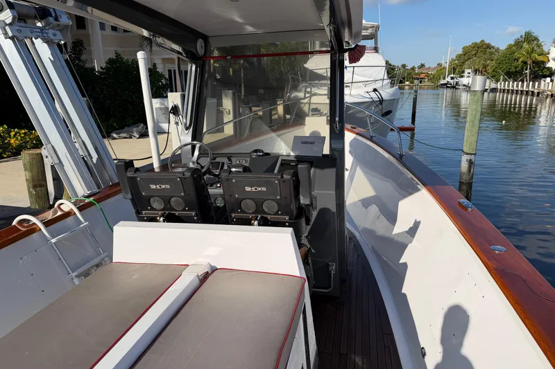 Slide: The Image of Custom 2013 Jet Center Console boat docked by a waterfront, featuring dual SHOCKS seats. - 17