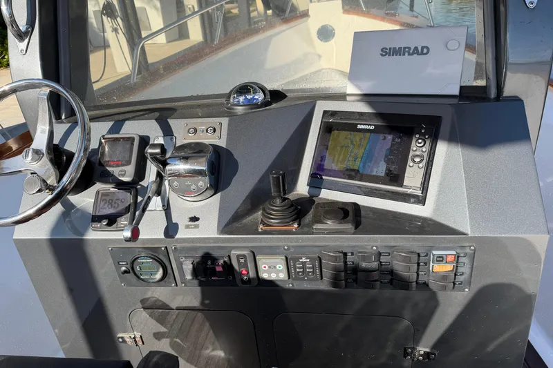 Slide: The Image of 2013 Custom Jet Center Console with Simrad navigation system and control panel. - 20