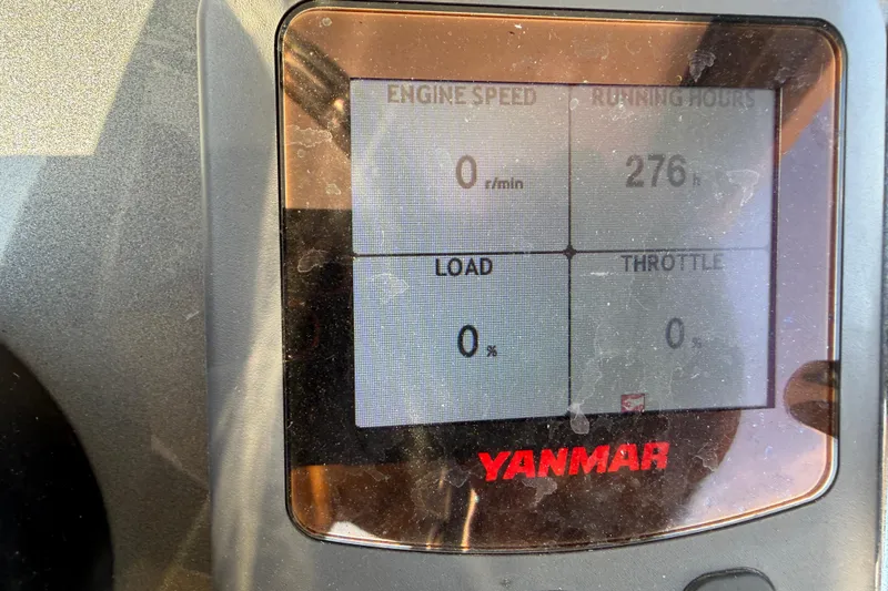 Slide: The Image of Yanmar engine display showing 276 running hours on a 2013 Custom Jet Center Console. - 22