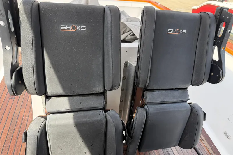 Slide: The Image of Dual SHOXS seats on a 2013 Custom Jet Center Console boat, featuring black upholstery. - 23