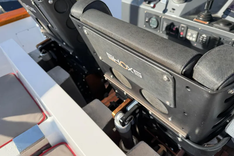 Slide: The Image of Custom 2013 Jet Center Console with black seats and control panel. - 25