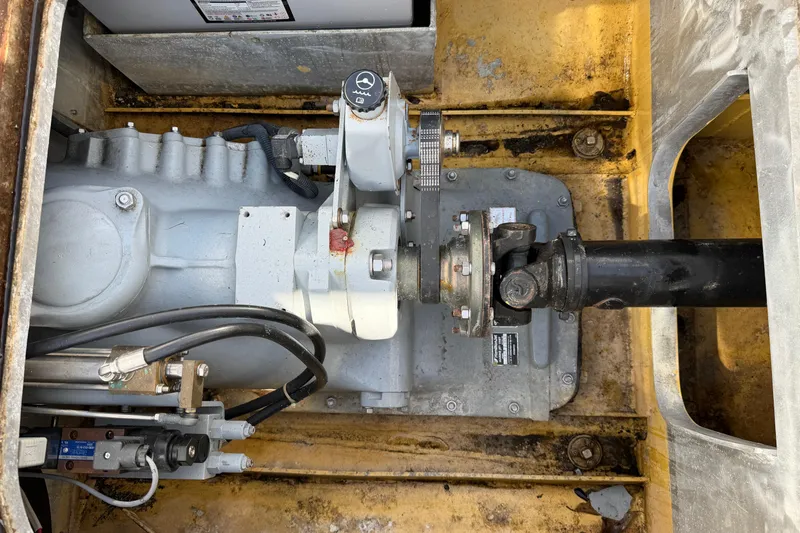 Slide: The Image of Engine compartment of a 2013 Custom Jet Center Console, showcasing mechanical components and connections. - 27