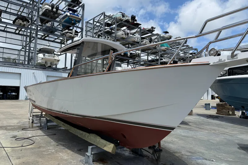 Slide: The Image of 2013 Custom Jet Center Console boat in storage facility, side view. - 3