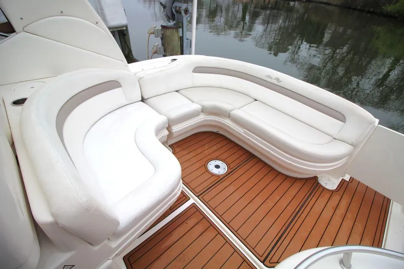 Slide: The Image of Luxurious seating area on 2004 Sea Ray 340 Sundancer yacht with teak flooring. - 16