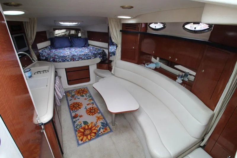 Slide: The Image of Luxurious interior of 2004 Sea Ray 340 Sundancer yacht with cozy seating and elegant decor. - 20