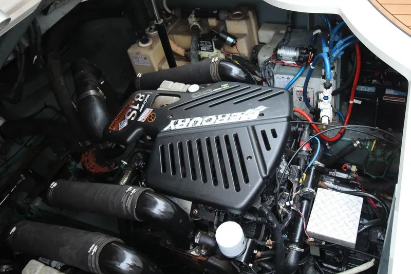 Slide: The Image of Engine compartment of a 2004 Sea Ray 340 Sundancer boat, showcasing detailed components. - 27