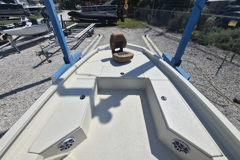 Slide: The Image of 2026 Xpress H24B Bay boat interior with seating and storage compartments. - 12