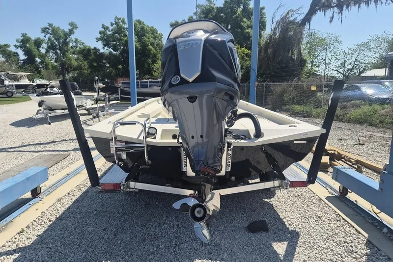 Slide: The Image of 2026 Xpress H24B Bay boat on trailer with powerful outboard motor. - 4