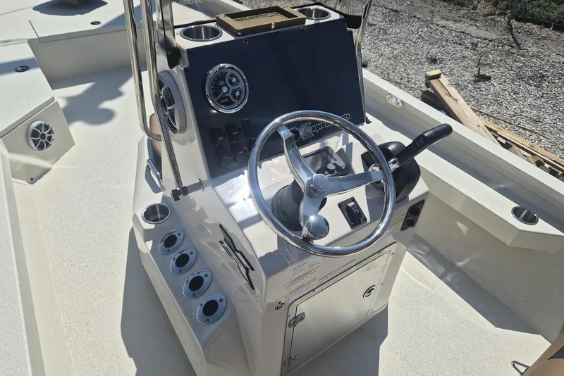 Slide: The Image of 2026 Xpress H24B Bay boat console with steering wheel and control panel. - 7