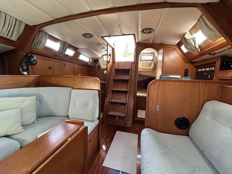Slide: The Image of Interior of a 1987 Wauquiez Centurion yacht with wooden furnishings. - 11