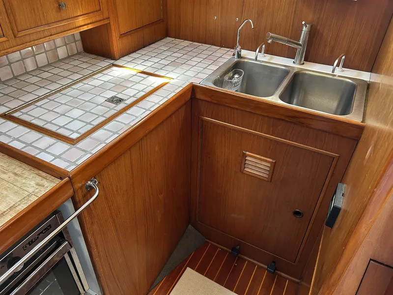 Slide: The Image of Galley area of a 1987 Wauquiez Centurion yacht with double sink. - 13