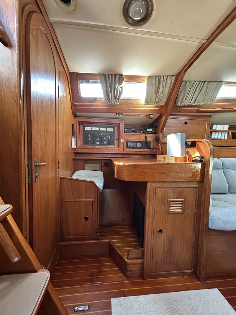 Slide: The Image of Interior of a 1987 Wauquiez Centurion yacht with wooden furnishings. - 21