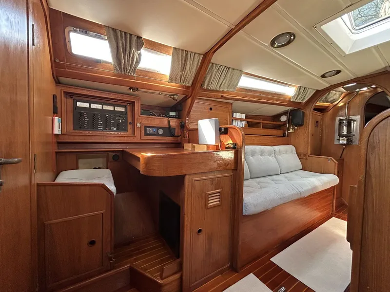 Slide: The Image of Interior of a 1987 Wauquiez Centurion yacht with wooden furnishings. - 22