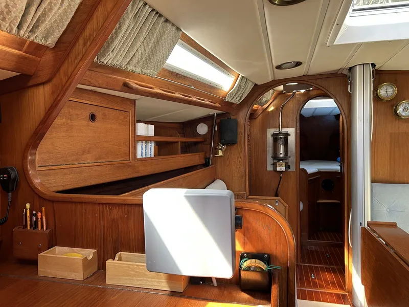 Slide: The Image of Interior of a 1987 Wauquiez Centurion yacht with wooden furnishings. - 28
