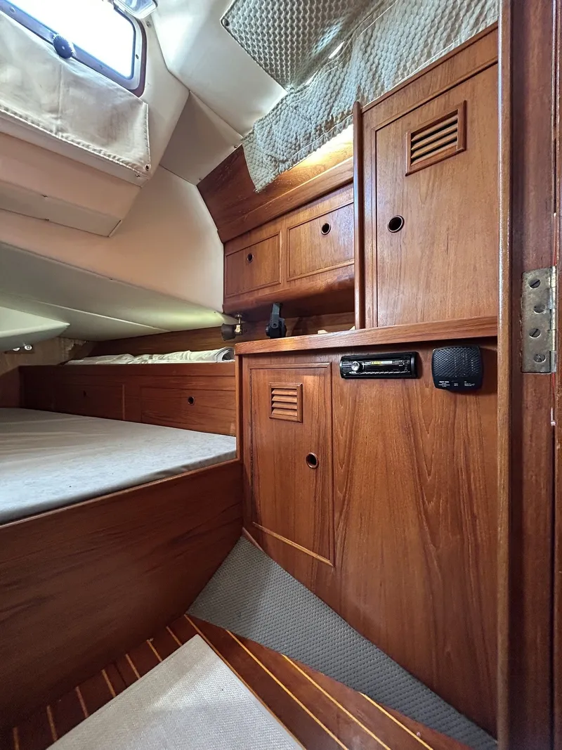 Slide: The Image of Interior of a 1987 Wauquiez Centurion yacht with wooden cabinetry. - 29