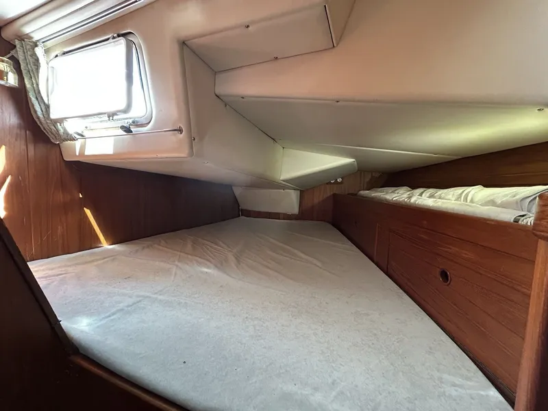 Slide: The Image of Interior of a 1987 Wauquiez Centurion yacht with sleeping area. - 30