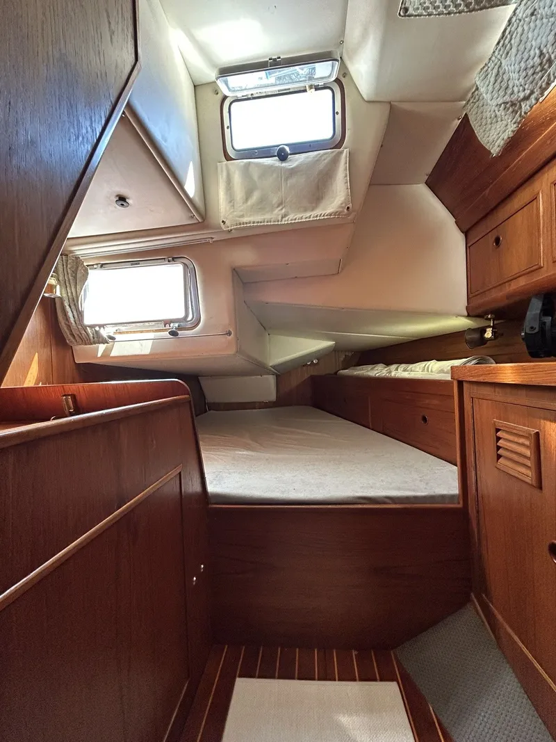 Slide: The Image of Interior of a 1987 Wauquiez Centurion yacht with wooden furnishings. - 31