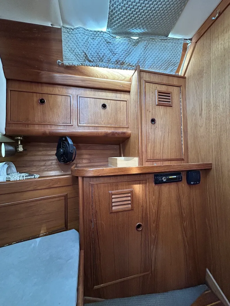 Slide: The Image of Interior of a 1987 Wauquiez Centurion yacht with wooden cabinetry. - 32