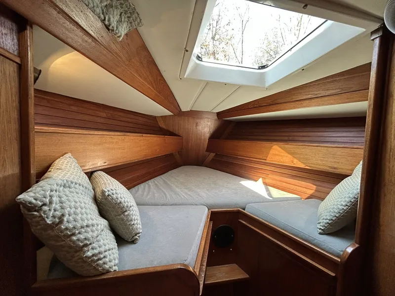 Slide: The Image of Interior of a 1987 Wauquiez Centurion yacht with wooden finish. - 35