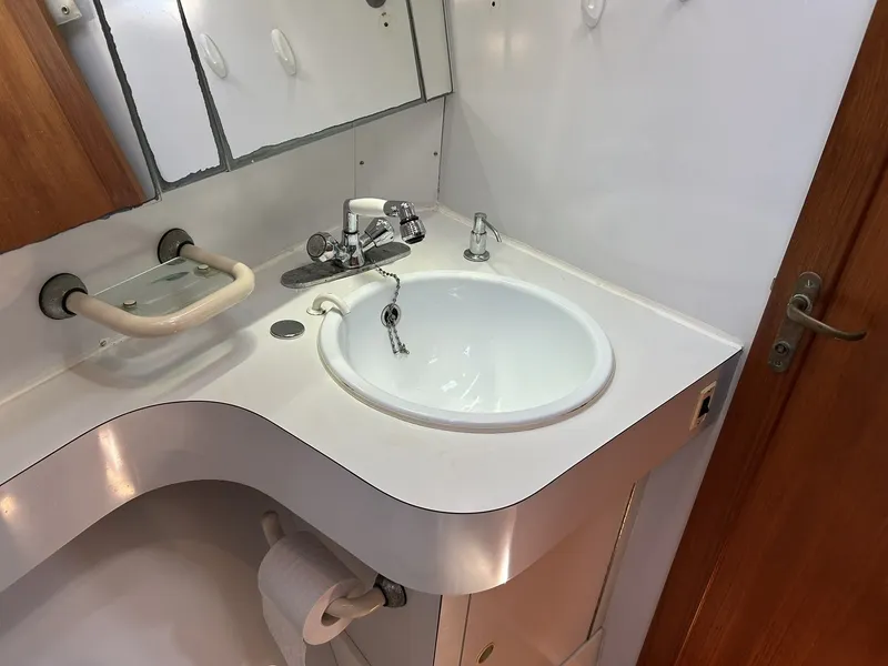 Slide: The Image of Bathroom in 1987 Wauquiez Centurion with sink and mirror. - 38