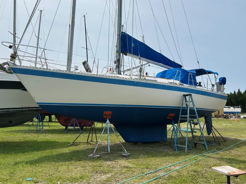 Slide: The Image of 1987 Wauquiez Centurion sailboat on stands outdoors. - 41