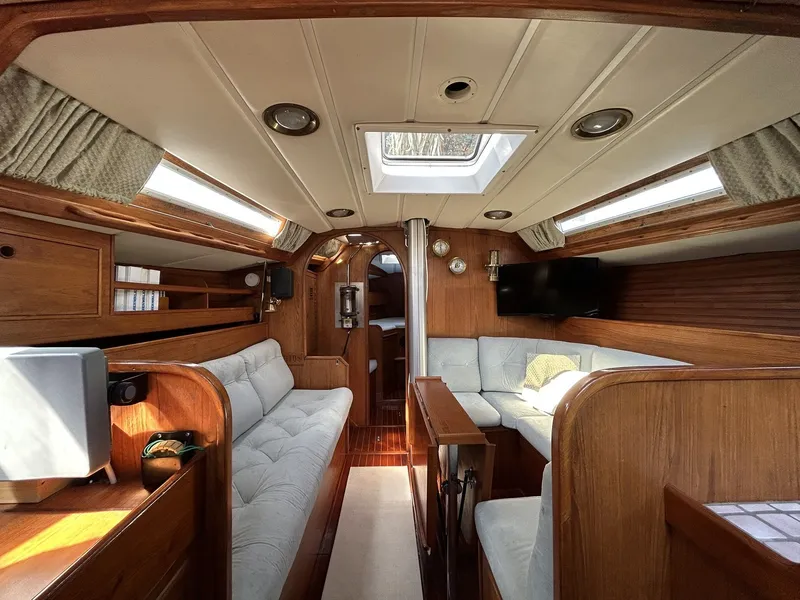 Slide: The Image of Interior of a 1987 Wauquiez Centurion yacht with wooden furnishings. - 7