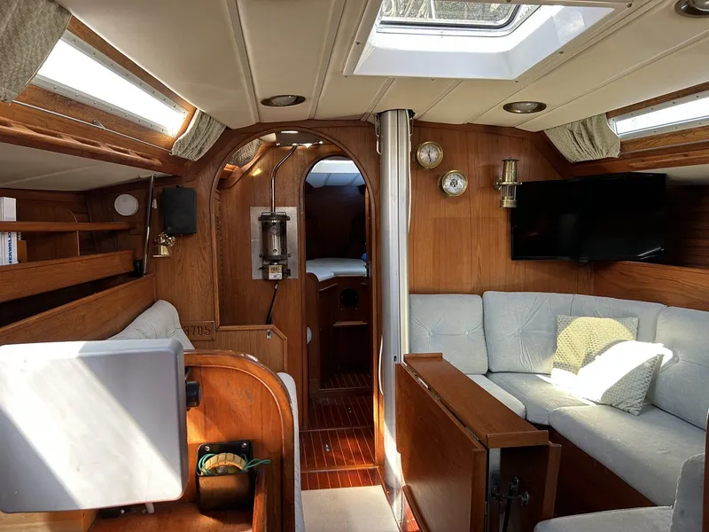 Slide: The Image of Interior of a 1987 Wauquiez Centurion yacht with wooden furnishings. - 8