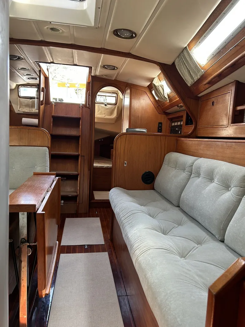 Slide: The Image of Interior of a 1987 Wauquiez Centurion yacht with wooden furnishings. - 9