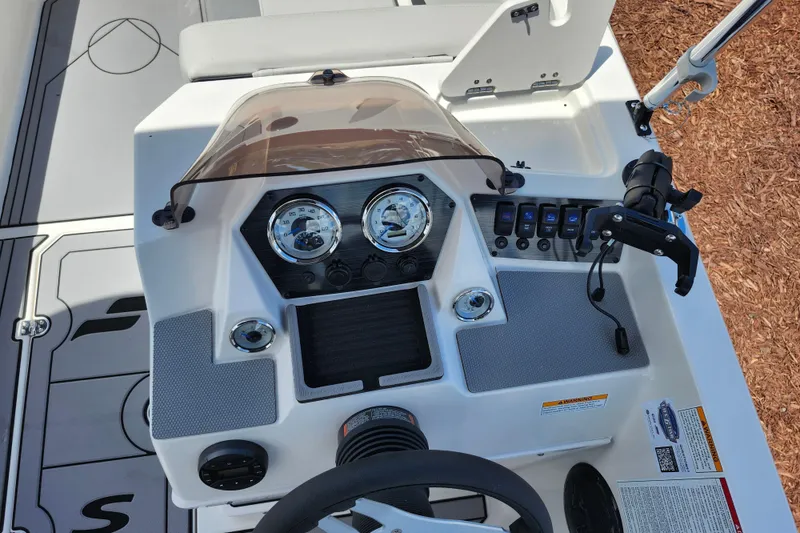 Slide: The Image of 2026 Starcraft SV 18 OB boat dashboard with gauges and controls. - 13