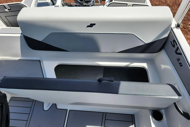 Slide: The Image of 2026 Starcraft SV 18 OB boat interior with seating and storage compartment. - 15