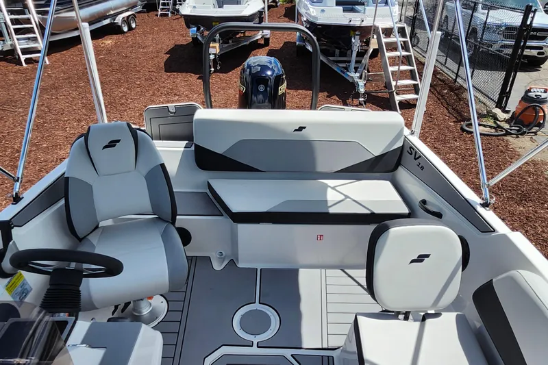 Slide: The Image of Interior of 2026 Starcraft SV 18 OB boat with seating and steering wheel. - 19