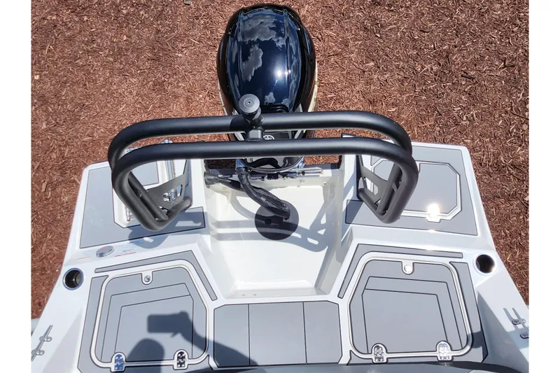 Slide: The Image of 2026 Starcraft SV 18 OB boat deck with motor and storage compartments. - 20