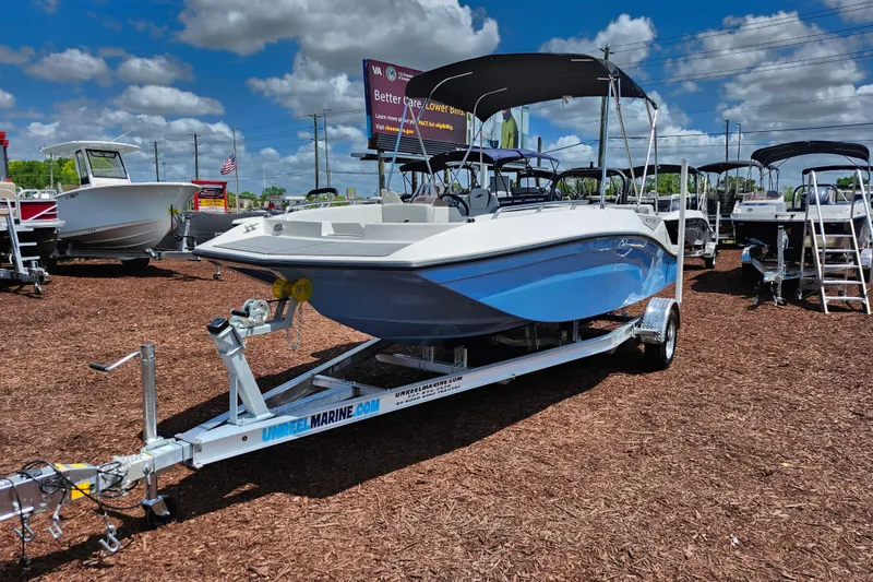 Slide: The Image of 2026 Starcraft SV 18 OB boat on trailer under blue sky at dealership. - 3