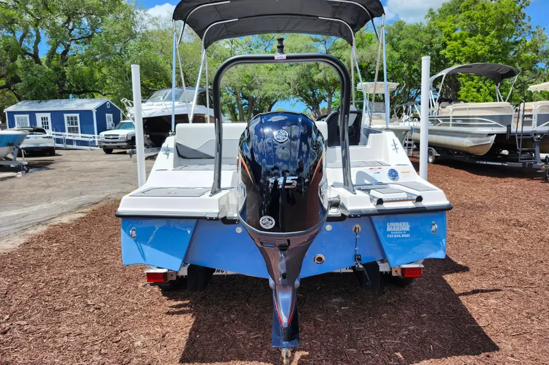Slide: The Image of 2026 Starcraft SV 18 OB boat with Yamaha 115 outboard motor, parked outdoors. - 6