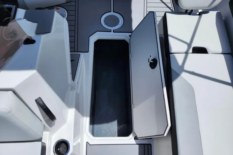Slide: The Image of Open storage compartment on 2026 Starcraft SV 18 OB boat deck. - 9