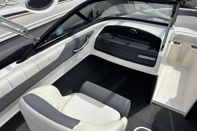 Slide: The Image of 2018 Bayliner 180 Bowrider interior with sleek dashboard and comfortable seating. - 8