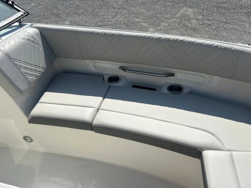 Slide: The Image of The 2027 Sea Ray 270SD-OB features an elegant, cushioned seating area with cup holders. - 17