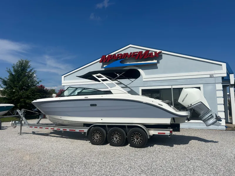 Slide: The Image of A 2027 Sea Ray 270SD-OB boat on a trailer in front of a MarineMax building. - 4