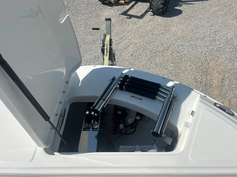Slide: The Image of An open storage compartment on a Sea Ray 270SD-OB boat reveals a folded ladder. - 18