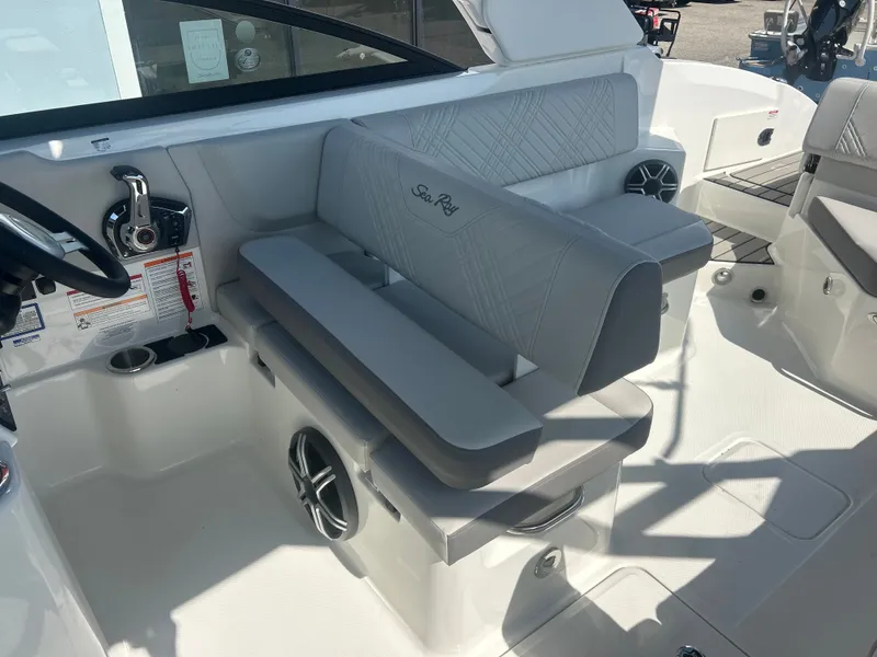 Slide: The Image of Interior of a 2027 Sea Ray 270SD-OB with gray upholstery and a modern helm station. - 10