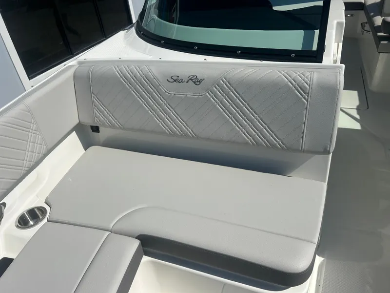 Slide: The Image of The image shows a bench seat on a Sea Ray 270SD-OB boat with gray upholstery. - 16