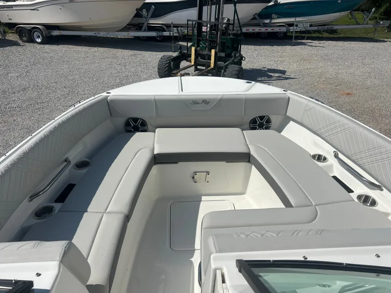 Slide: The Image of The image shows the cockpit of a Sea Ray 270SD-OB boat with white upholstery. - 14