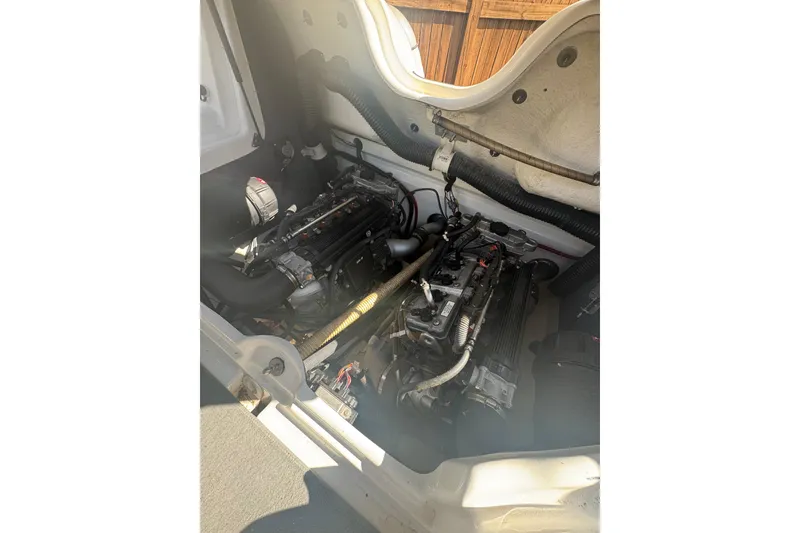 Slide: The Image of 2012 Yamaha AR210 boat engine compartment with dual engines visible. - 12